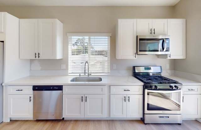 Comes with TV! 4BD/2BA Private Yard and 4 Off Street Parking spots! (Lease out, pending signatures. Check back in a few days!) Gallery 4