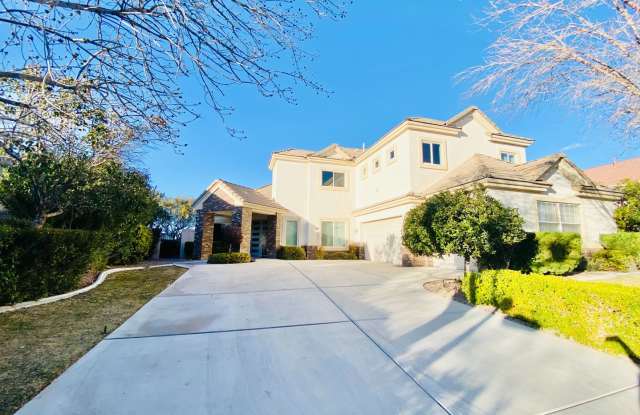 Beautiful 2 Story home in Queensridge guard gated community with spacious 5 bedrooms & 4 bathrooms. Luxury features and High Ceilings, 3 car garage, Private Backyard and great natural lighting. Guard gated, zoned for Pal Verde High School. Gallery 3
