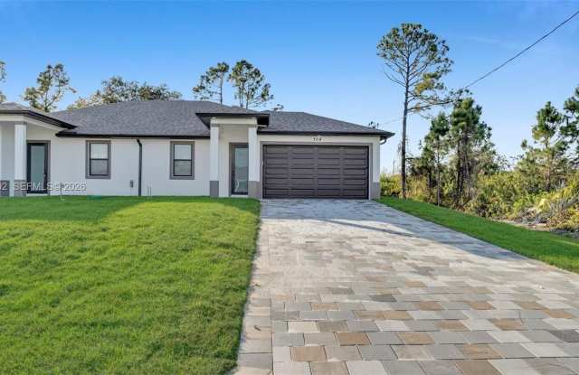 704 Homer Ave - 704 Homer Avenue South, Lehigh Acres, FL 33973