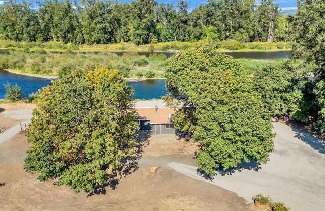 RARE RIVERFRONT HOME WITH LARGE SHOP ON ACREAGE!! Gallery 3