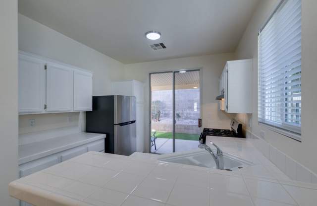 SUMMERLIN BEAUTY*UPGRADED*COMMUNITY POOL*3 BEDROOMS*STAINLESS STEEL APPLIANCES* photos photos