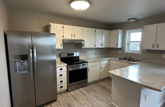 BEAUTIFULLY UPDATED 3 BEDROOM, 2 BATHROOM TWIN HOME WITH ATTACHED 1 CAR GARAGE photos photos