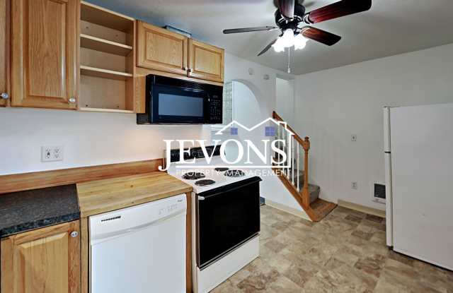 Two-story home in a walkable location, just minutes from Yakima Valley College, featuring long driveway parking photos photos