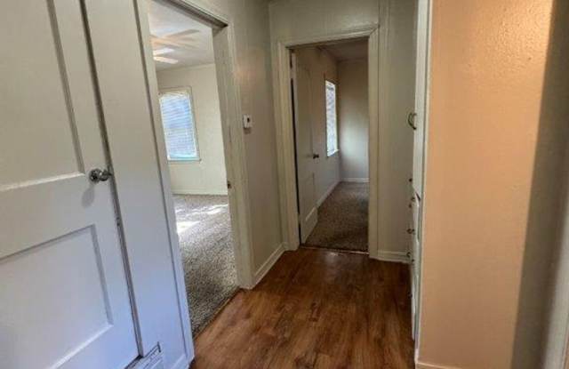 Lots of character, wood vinyl flooring and carpet, large, fenced yard, ready for move in! Gallery 4