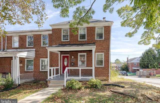 Welcome to this beautifully renovated 4bd 2bth end-of-group townhome in Baltimore! photos photos