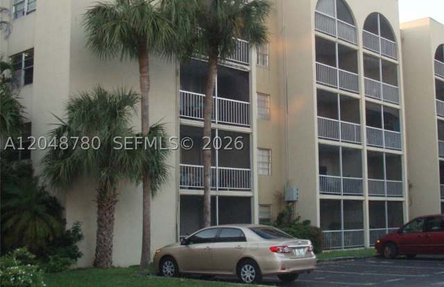 6980 NW 186th St - 6980 Northwest 186th Street, Country Club, FL 33015