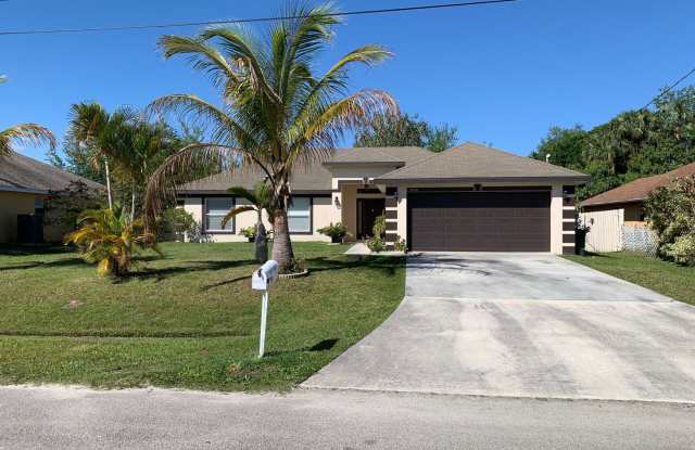 4 Bedroom 2 bath CBS House with 2 car garage - 3630 Southwest Carmody Street, Port St. Lucie, FL 34953
