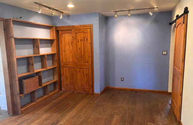 BRECK two living spaces! Fenced backyard! Bus route! Community hot tubs, pool, sauna, volleyball court, and tennis courts! Gallery 4