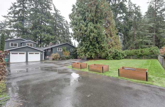 Mercer Island: 5-Bed, 4-Bath Home with Water Views, Large Yard, Updated Kitchen, Private Primary Suite Gallery 1