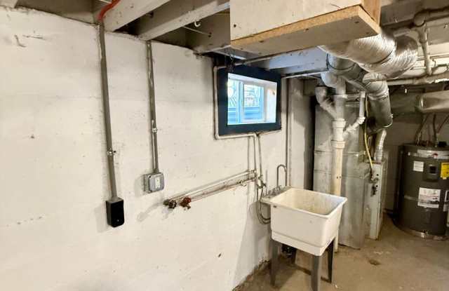 Newly updated 3bdrm, 2 bath house with large basement and covered parking. Gallery 3