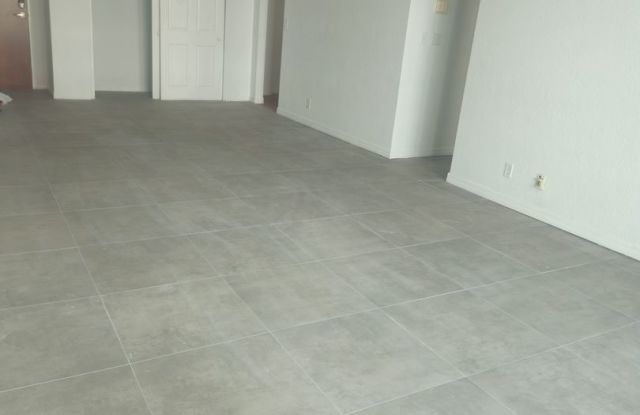 Live just steps from the beach in this beautifully located unit at 3801 S Ocean Drive photos photos