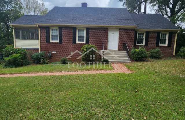 Beautiful 2-Story Brick Home Near Anderson University with Original Hardwood Floors  Screened Porch - 1014 Calhoun Drive, Anderson, SC 29621