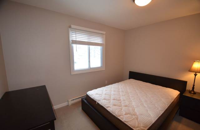 Price Reduced! Blue River Condo! Bus route and additional storage! Year lease! Unfurnished Gallery 4