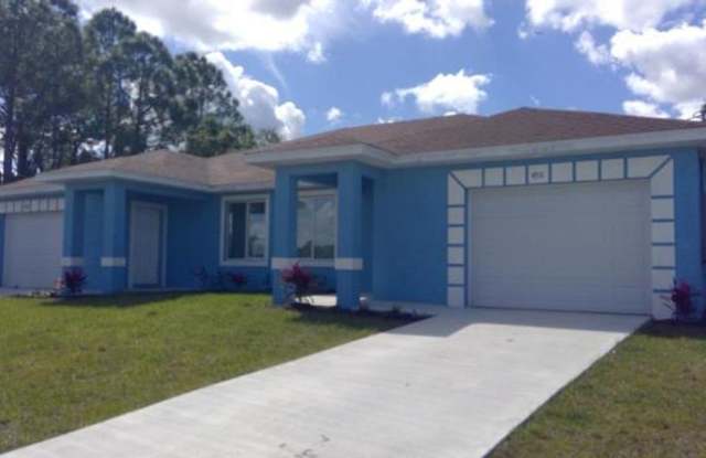 Newer Three Bedroom, 2 Bath, 1 Car garage- Duplex in Lehigh Acres photos photos