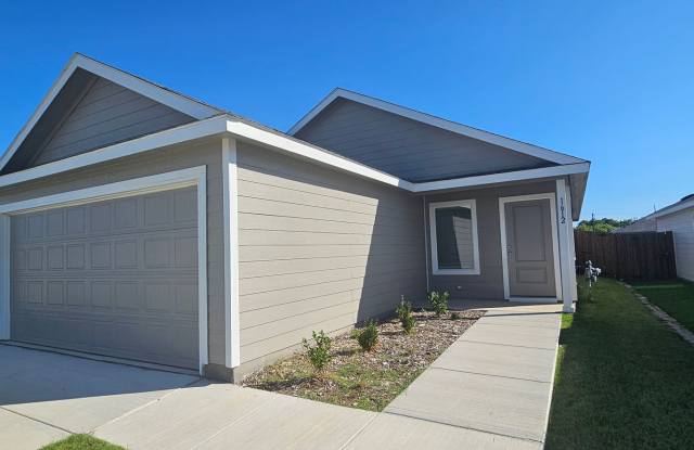 Single-level home with a spacious open floorplan shared between the kitchen, dining area and family room. photos photos