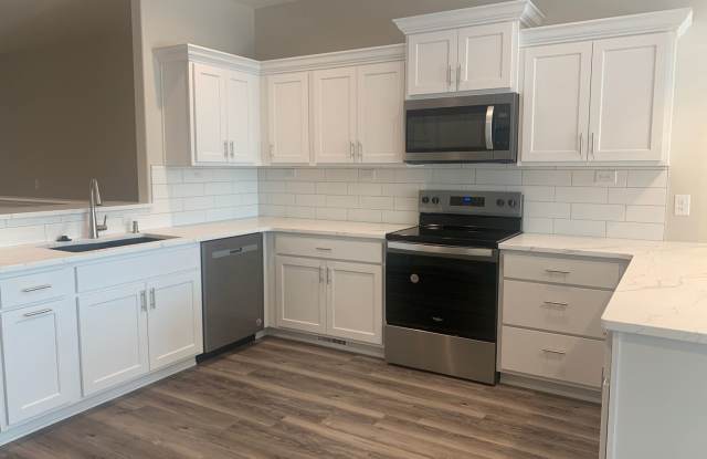 Walkout ranch townhome with 2 stall garage. Spacious 2 bedrooms with walk in closets, 2.5 bathroom, 1st floor laundry photos photos