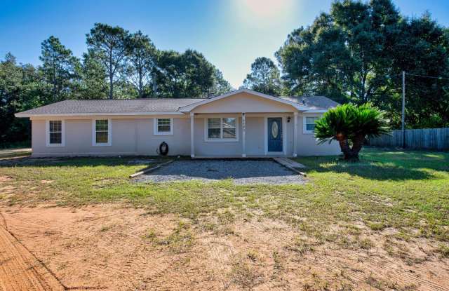 ½ OFF FIRST MONTH’S RENT! Spacious 3-Bedroom Navarre Home with Covered Patio Gallery 3