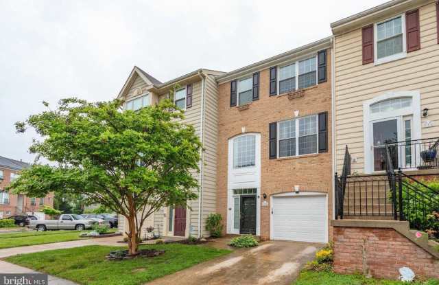 Spacious and sun filled townhome with a one car garage in the sought after Belmont Bay community. photos photos