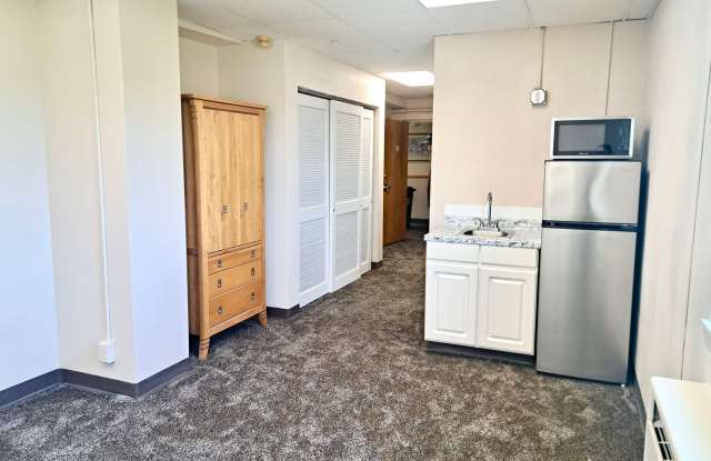 UNDER NEW MANAGEMENT: Spacious 1BR Efficiency w/ Tons of Storage! All-Inclusive "One Bill" Living, Free Wi-Fi & Laundry! Gallery 1