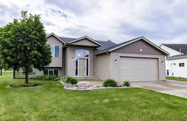Spacious 4-Bedroom Home with a Huge Fenced Yard in West Fargo! photos photos