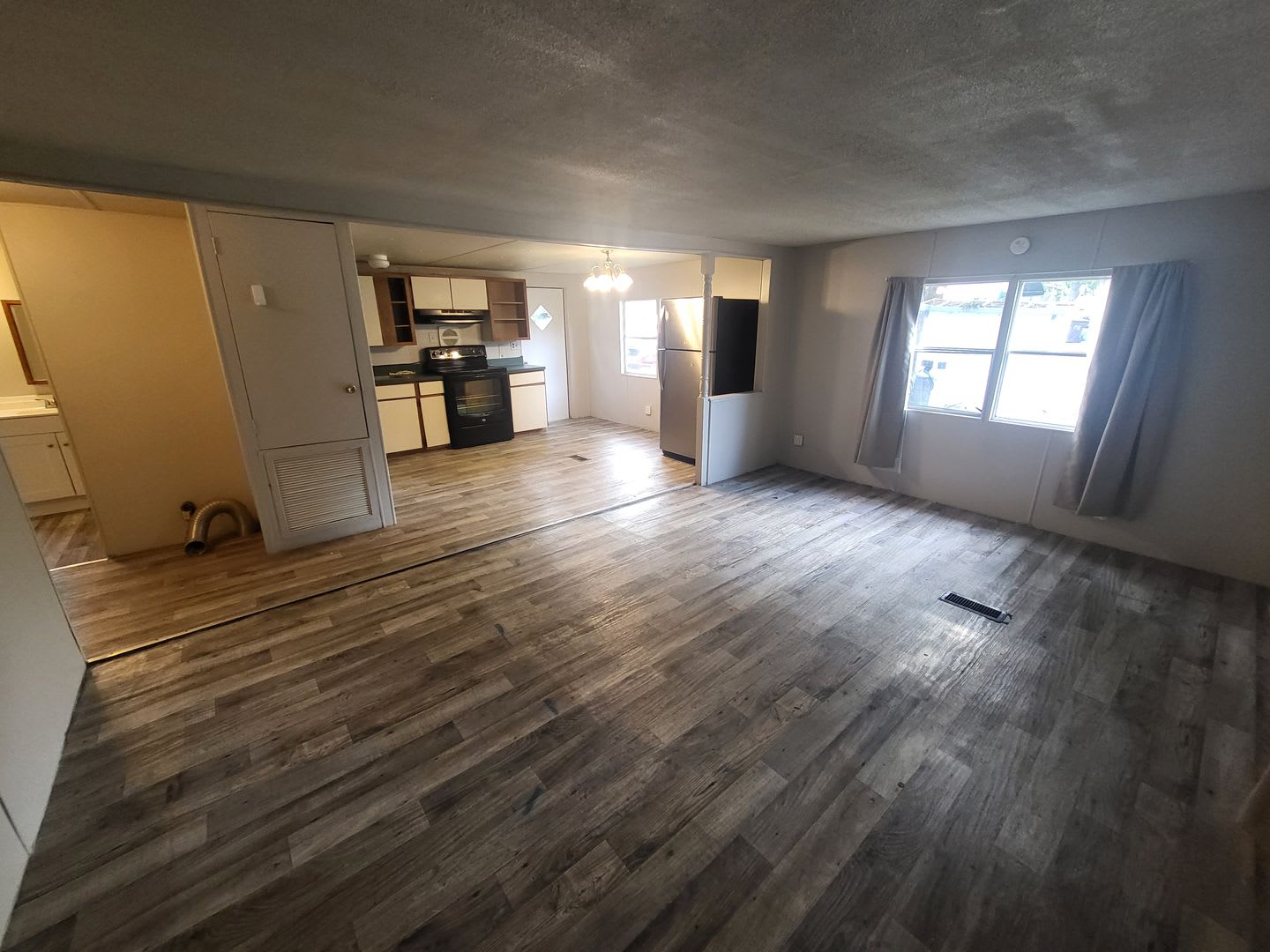 Freshly painted spacious 2-bedroom 1-bath home with a screened porch and storage shed. – photo 1