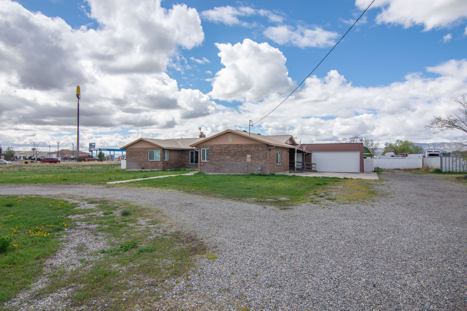 Spacious 3 Bed 2 Bath Brick Home with RV Parking, Shop Space &amp; Large Yard in Tremonton! – photo 1 of 42