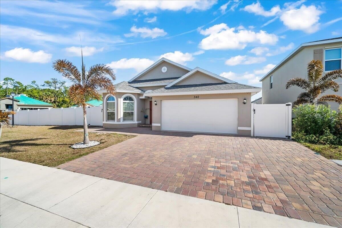 340 PALM BREEZES Drive – photo 1