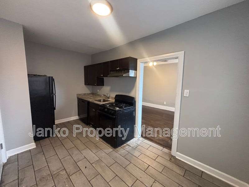 6055 S Troy St – photo 1