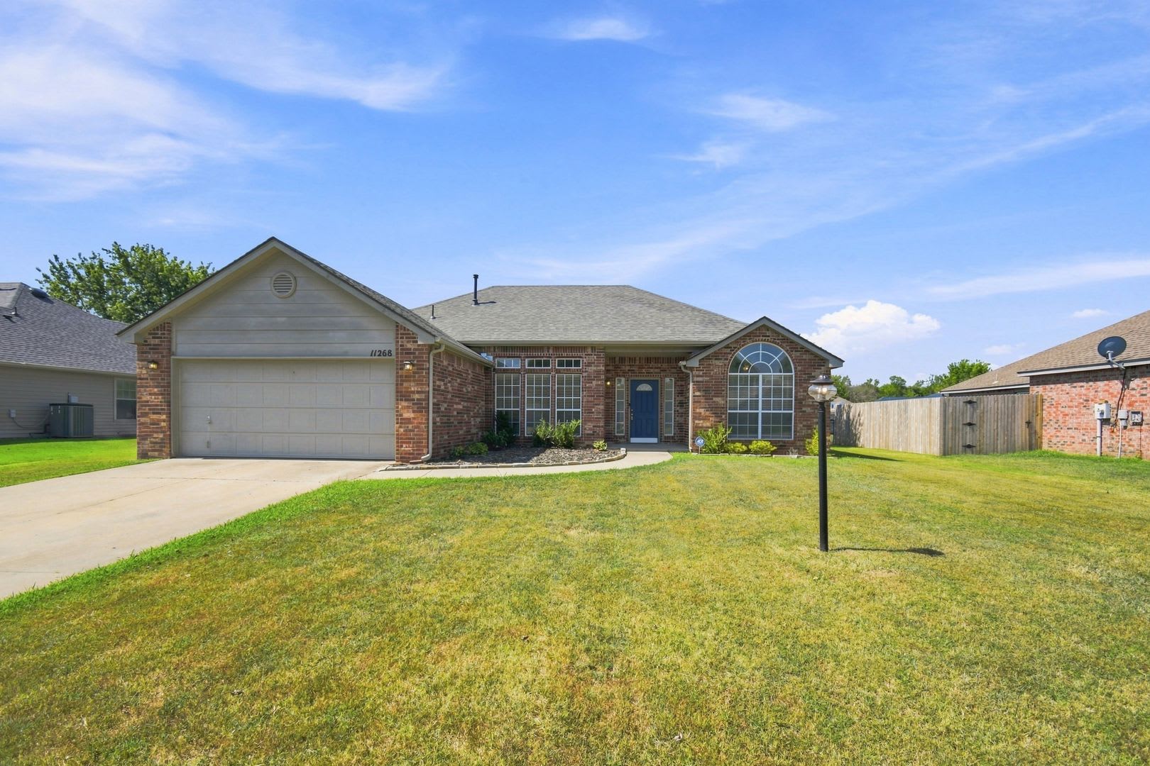 Spacious 3-Bedroom Home in Coweta with Fireplace &amp; Covered Patio! – photo 1 of 22