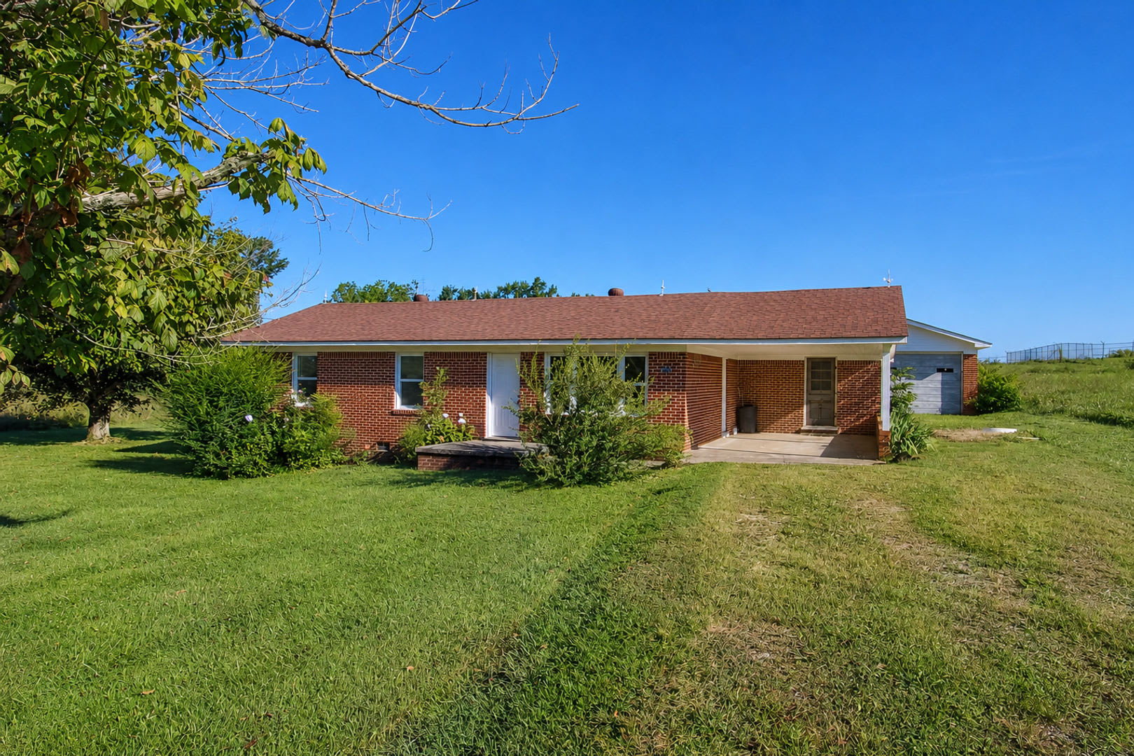 Updated 3-Bedroom Home with Covered Porch and Detached Garage in Baxter – photo 1 of 21