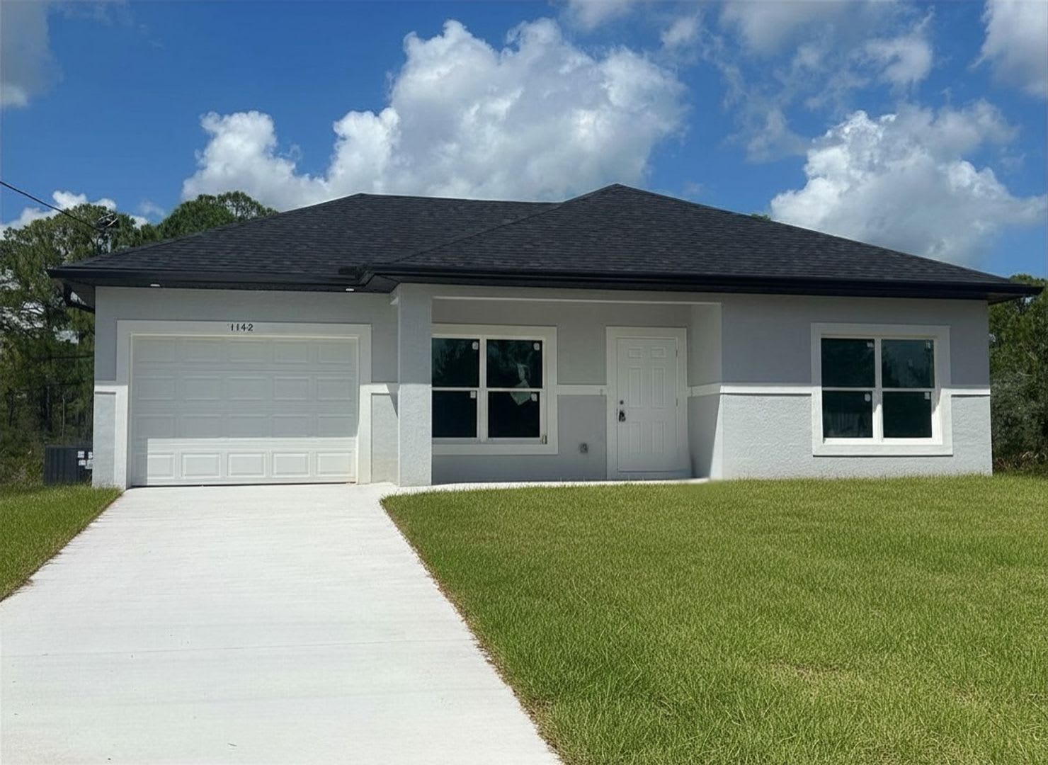 Brand-New Modern 2BR/2BA Home with Garage – Quiet Lake Placid Neighborhood – photo 1