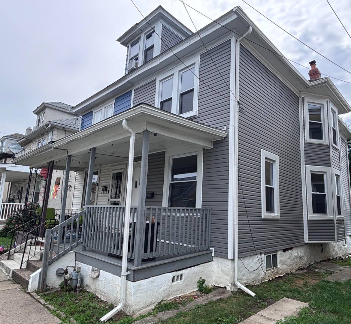 Twin home with updated kitchen, washer/dry on first floor, private back yard and porch. – photo 1 of 13