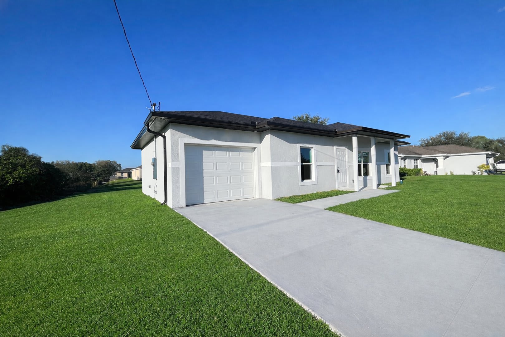 NEW CONSTRUCTION- Modern 3 Bed / 2 Bath Home in E Lehigh Acres – photo 1