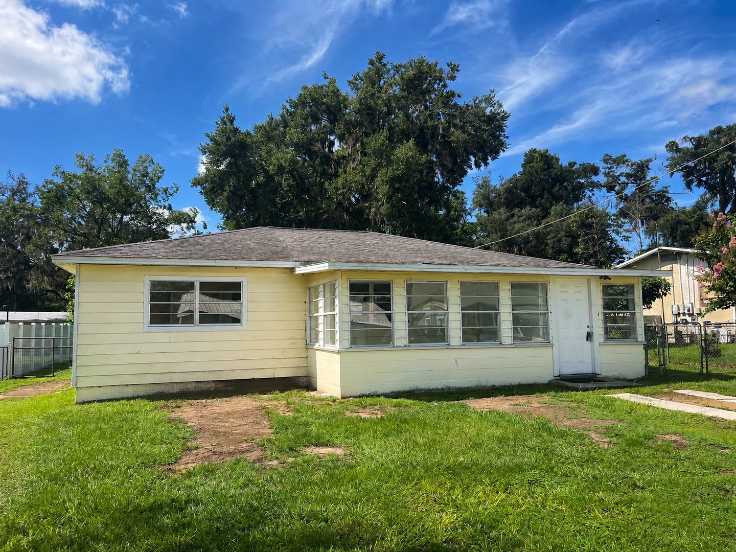 Spacious 3BR/1BA Dade City Home with Enclosed Front Porch & Large Backyard – photo 1 of 11