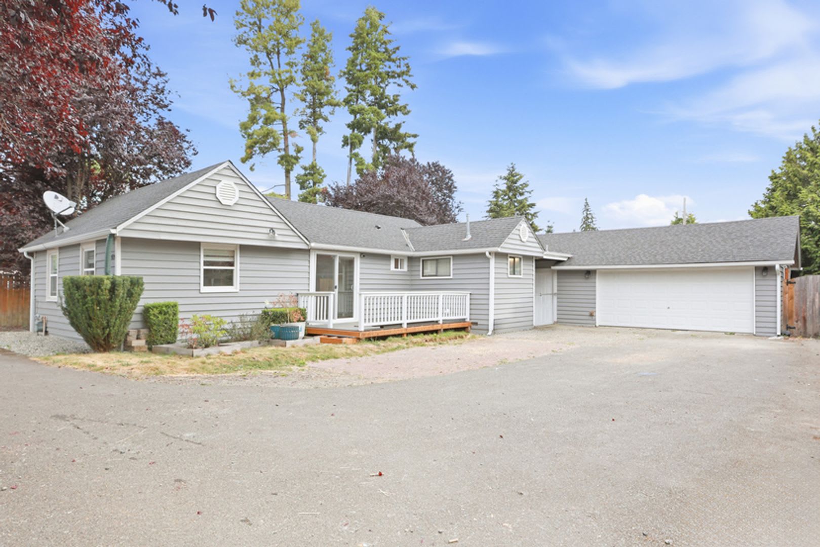 Updated Rambler with covered patio and large detached garage. – photo 1