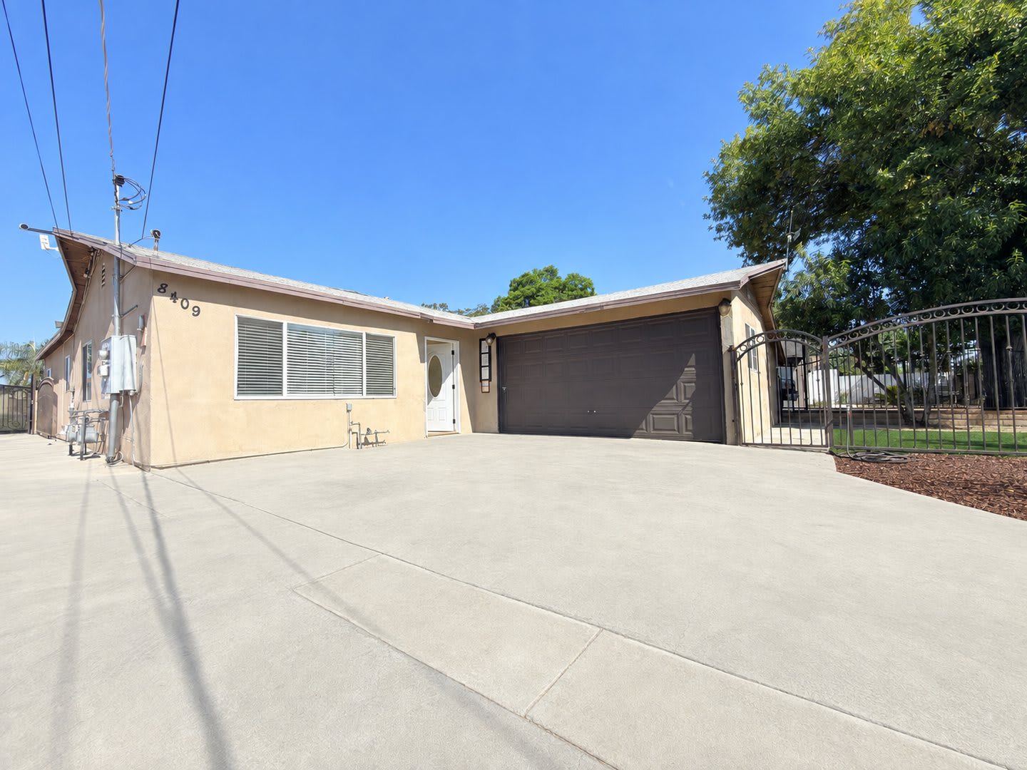 Spacious 4-Bedroom, 2-Bath Gated Home with Garage & Private Backyard – photo 1