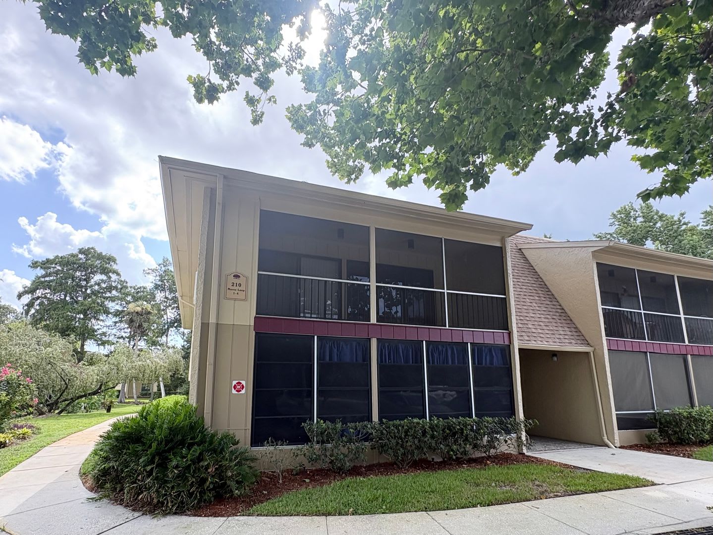 Nicely Updated 1/1 Condo in Winter Springs ~ Wood Plank Tile Floors and Large Screened Patio! – photo 1 of 31