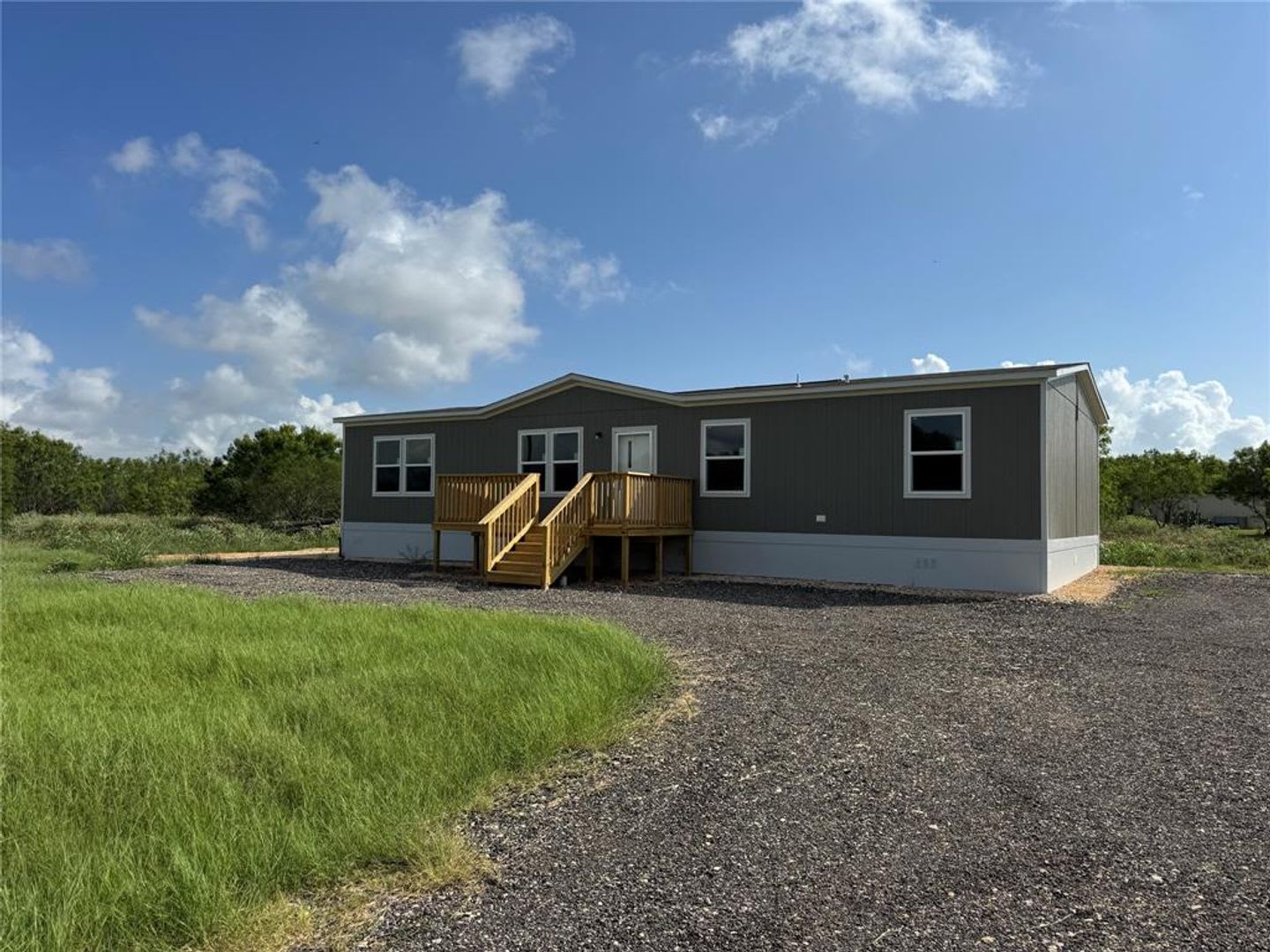 BRAND NEW DOUBLE-WIDE MANUFACTURED HOME ON OVER 1 ACRE! – photo 1 of 11