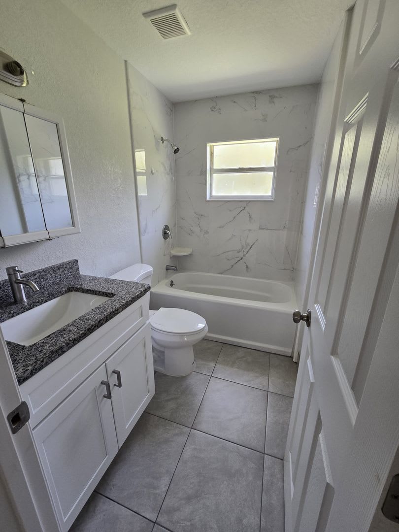 Beautiful Open Floor Plan 2 Bedroom 1 Bathroom Home 2 Car Parking Open Kitchen With Wood Cabinets And Newly Installed Tile Flooring Throughout The Home – photo 5
