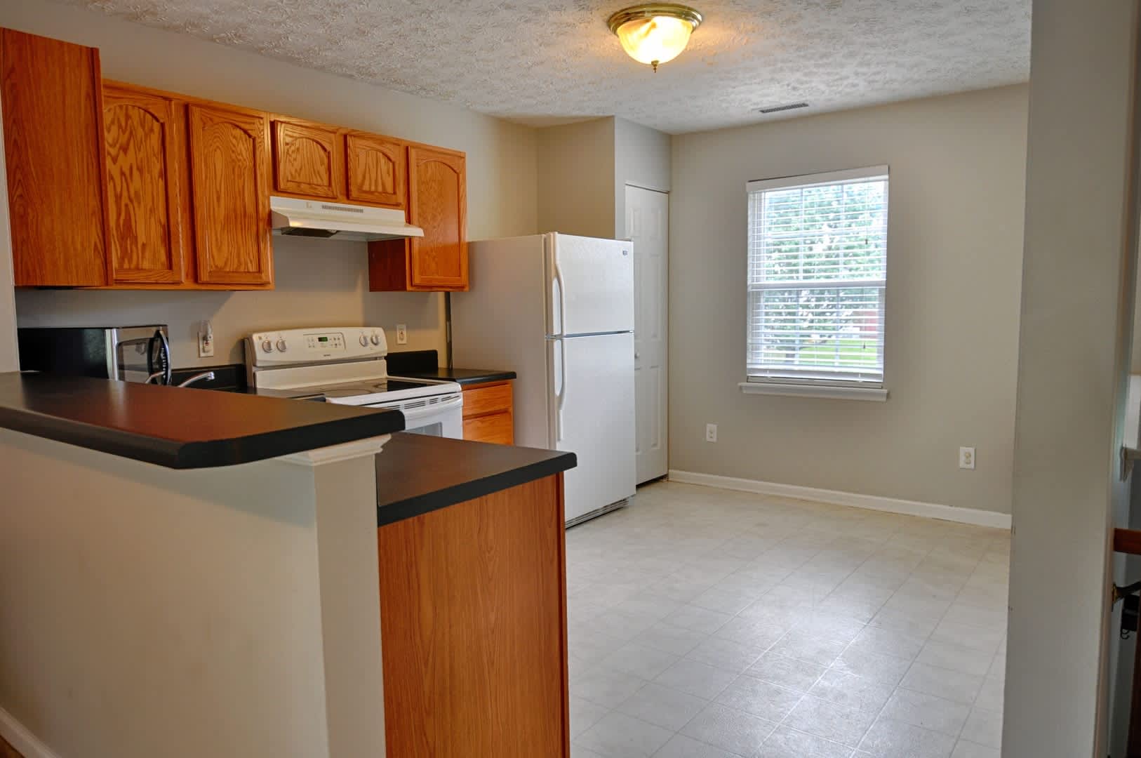 Amazing 4 bed/2 bath split level home conveniently located near RTP with fenced yard! – photo 3