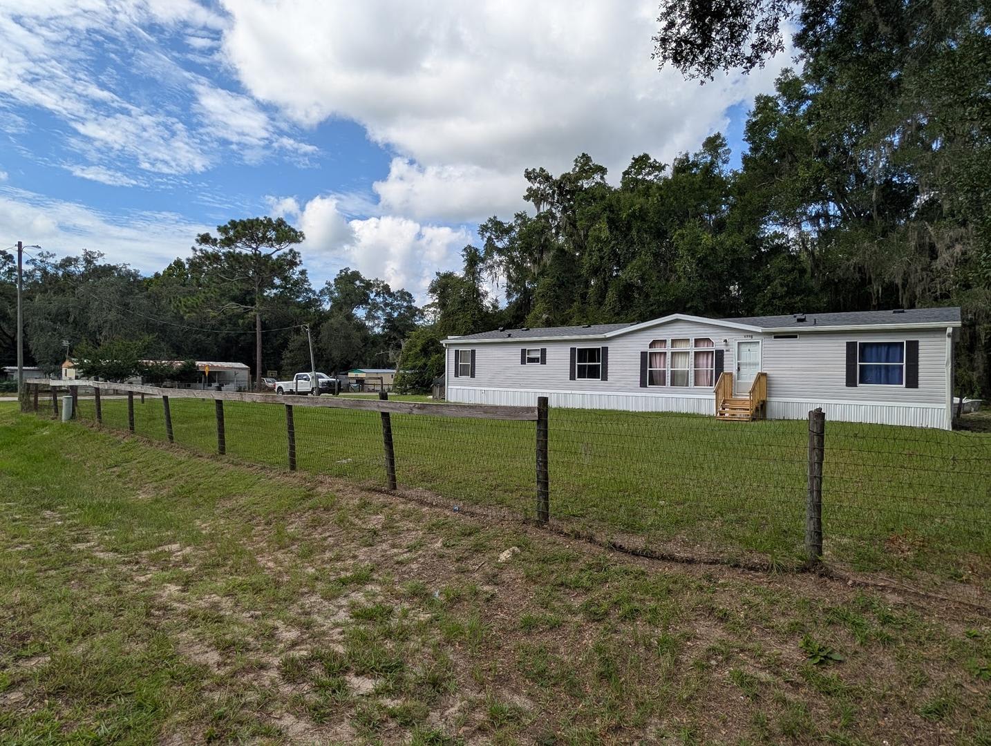 3 bedroom 2 bath with NEW roof on 1/2 acre of land with a FENCED YARD – photo 2