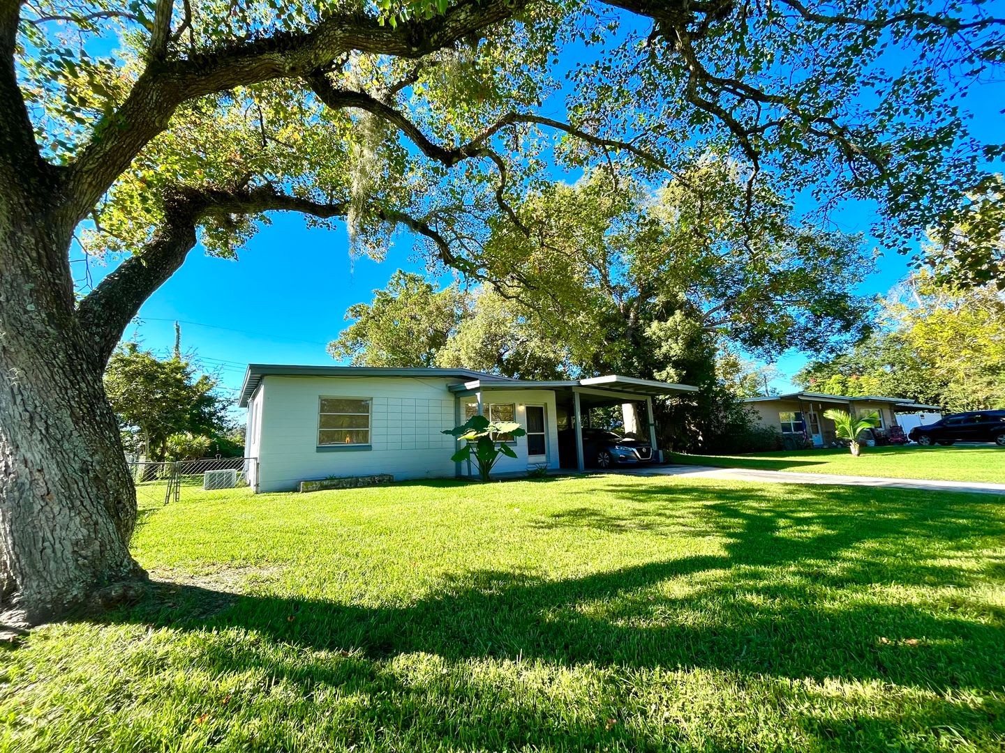 Lawn Service included with this 2BR/1BA w/Carport, Office, and Bonus Room – photo 2