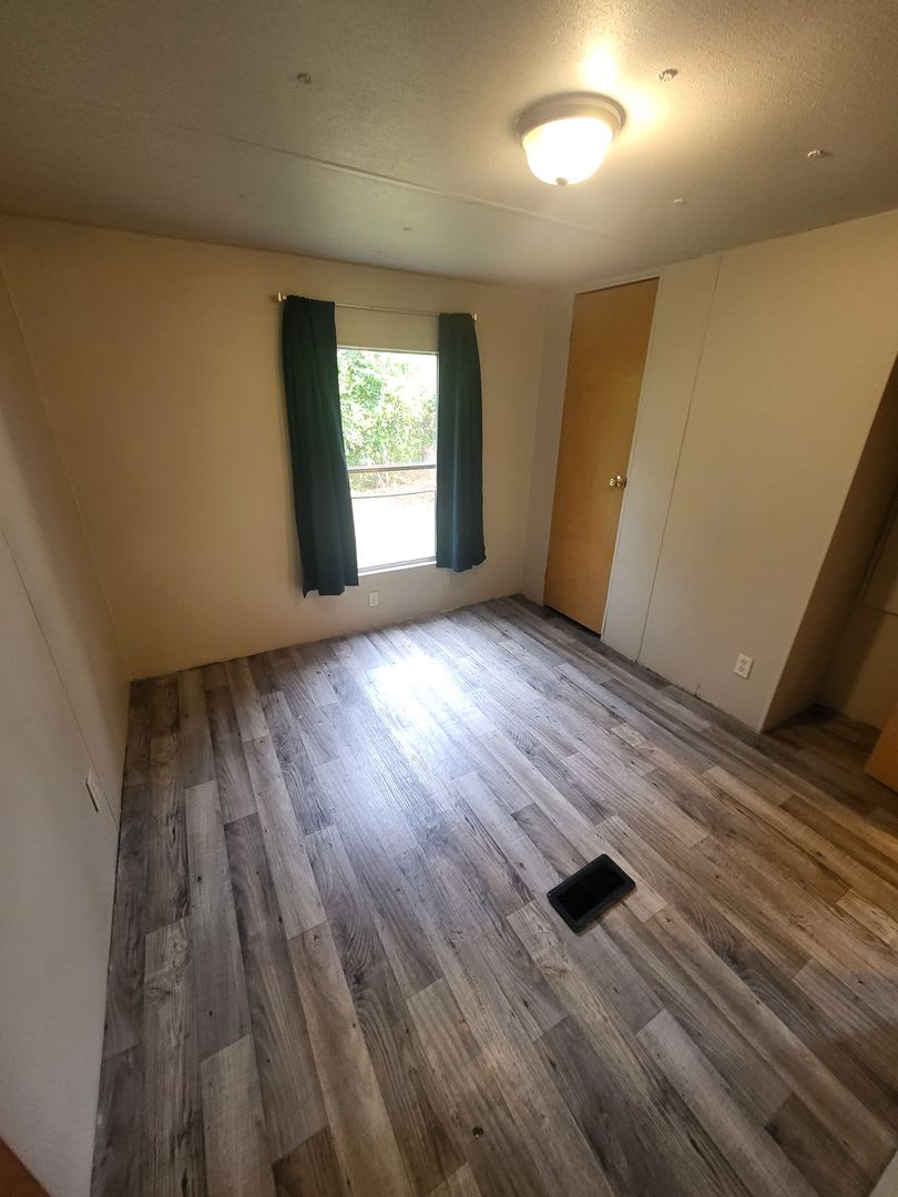 Freshly painted spacious 2-bedroom 1-bath home with a screened porch and storage shed. – photo 4