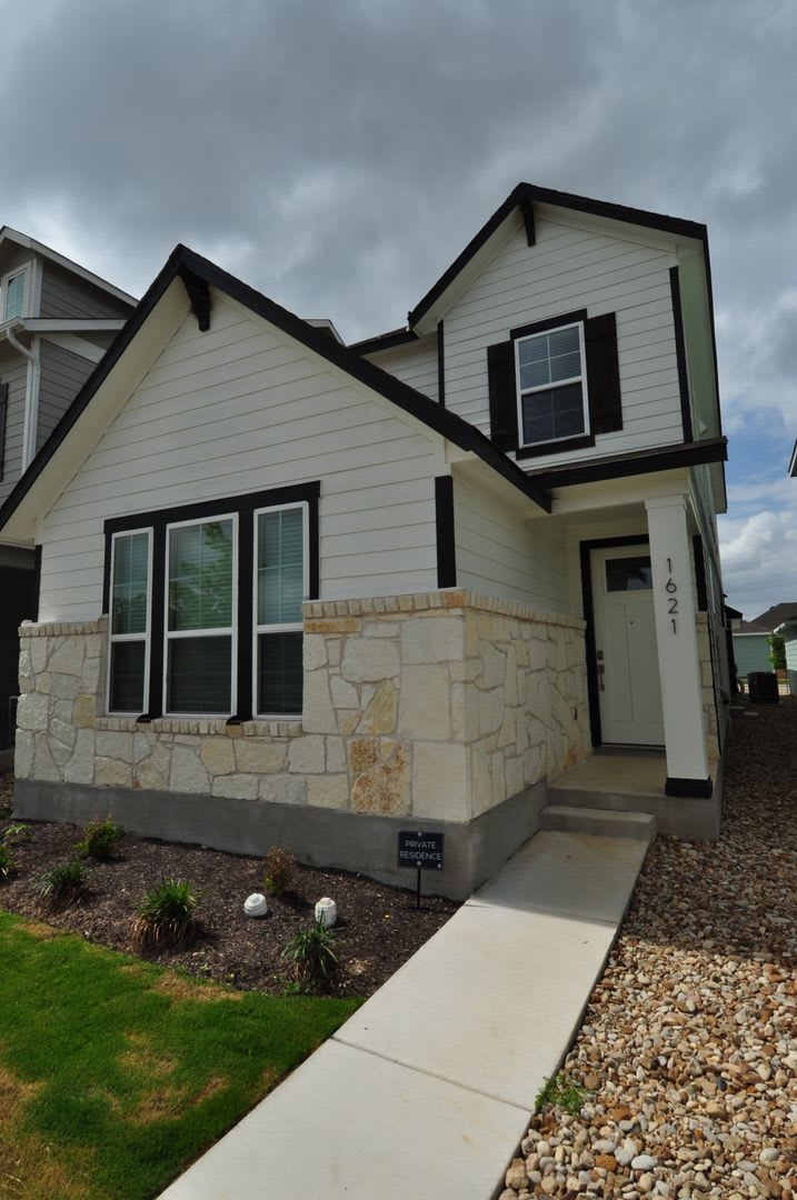 Enjoy a lock and leave lifestyle in this brand new cottage style home at The Retreat at Hero Way – photo 1