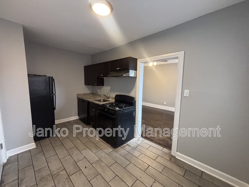 6055 S Troy St – photo 1