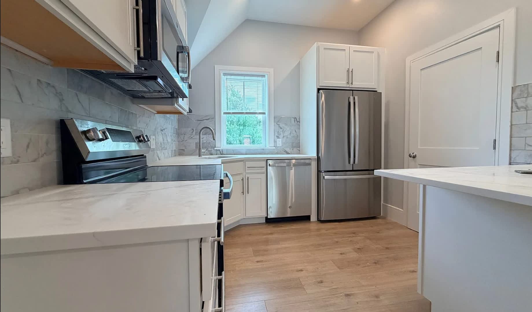 Brand New Construction in Perfect Location! Laundry in Unit, Centralized Heating and A/C! Pro Managed! – photo 1