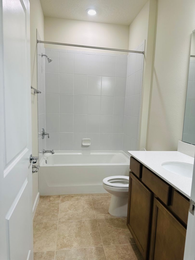 Welcome to this BRAND NEW 4-bedroom, 2-bathroom home located in the community of Canopy Terrace – photo 4