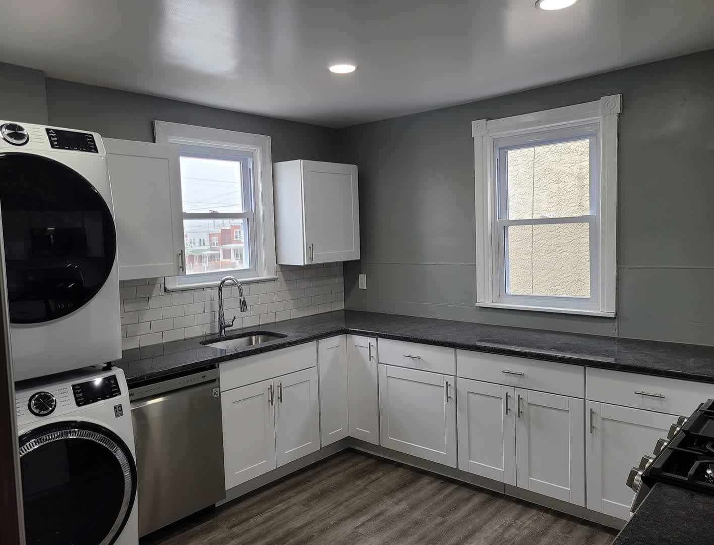 Twin home with updated kitchen, washer/dry on first floor, private back yard and porch. – photo 4
