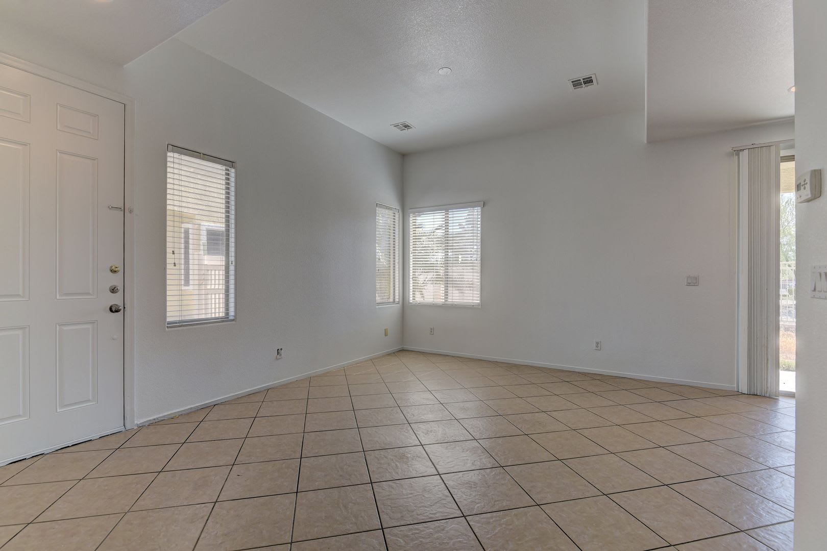 Elegant tile flooring extends throughout the entire downstairs area – photo 4