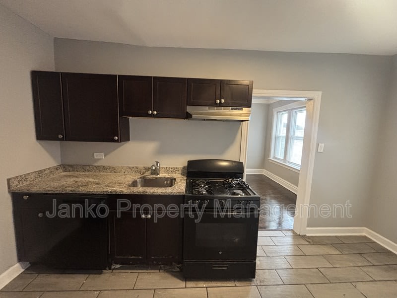 6055 S Troy St – photo 2